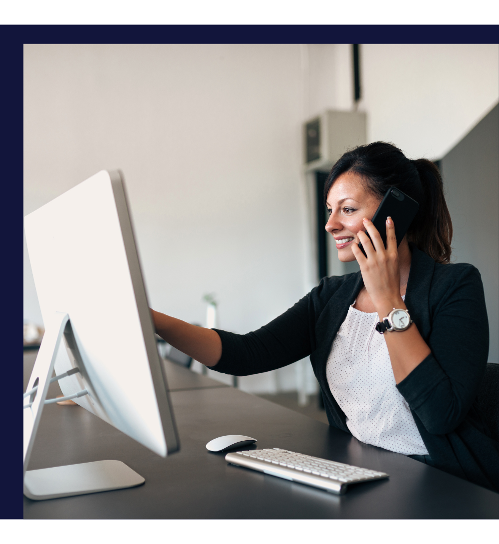 A woman working on a computer using OrderScope Custom Integration Solutions. A woman working on a computer using OrderScope Custom Integration Solutions.