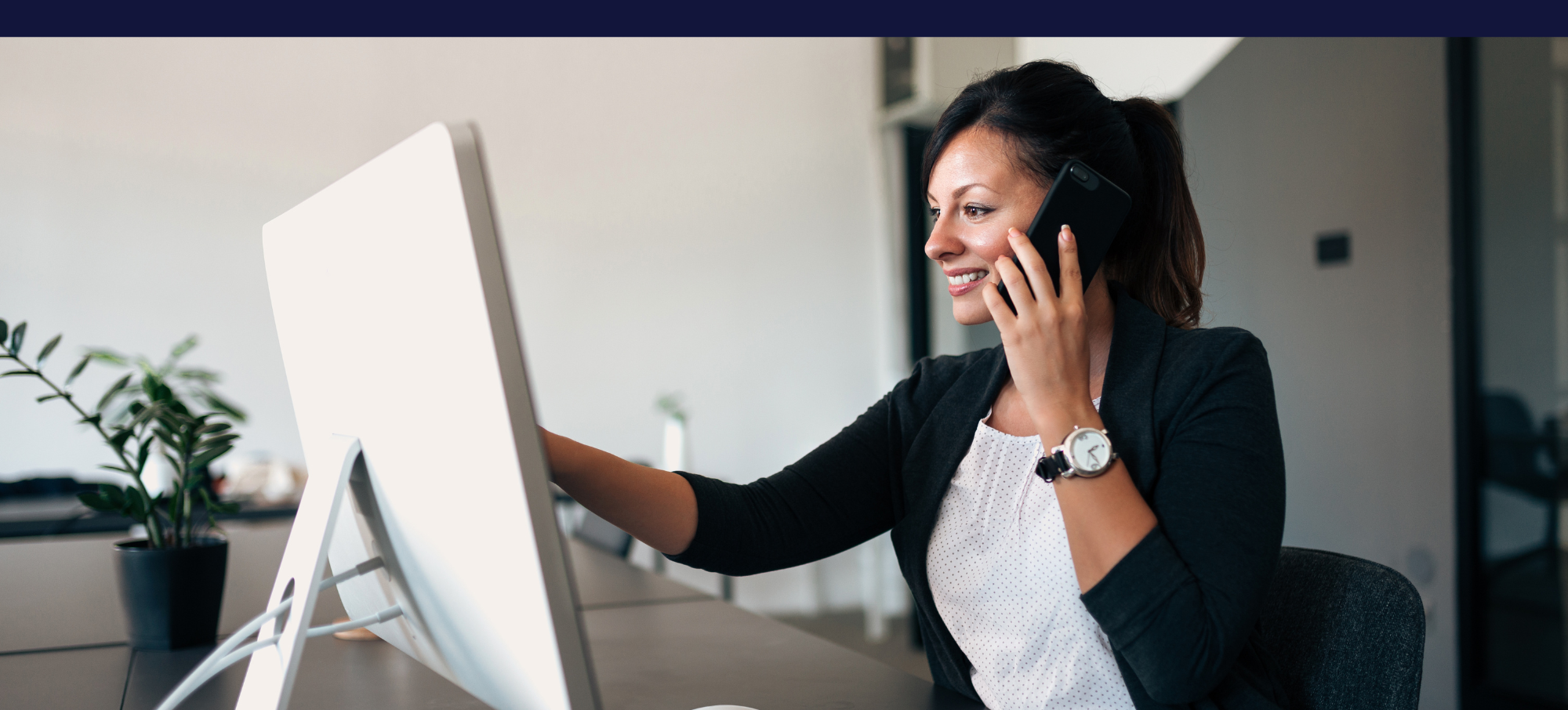 A woman working on a computer using OrderScope Custom Integration Solutions. A woman working on a computer using OrderScope Custom Integration Solutions.